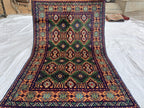 5x3 Geometric Maranus Rug – Hand-Knotted Afghan Tribal Carpet 5.4x3.4 ft | Vintage Wool Area Rug | Bold Green and Peach Bohemian Home Décor