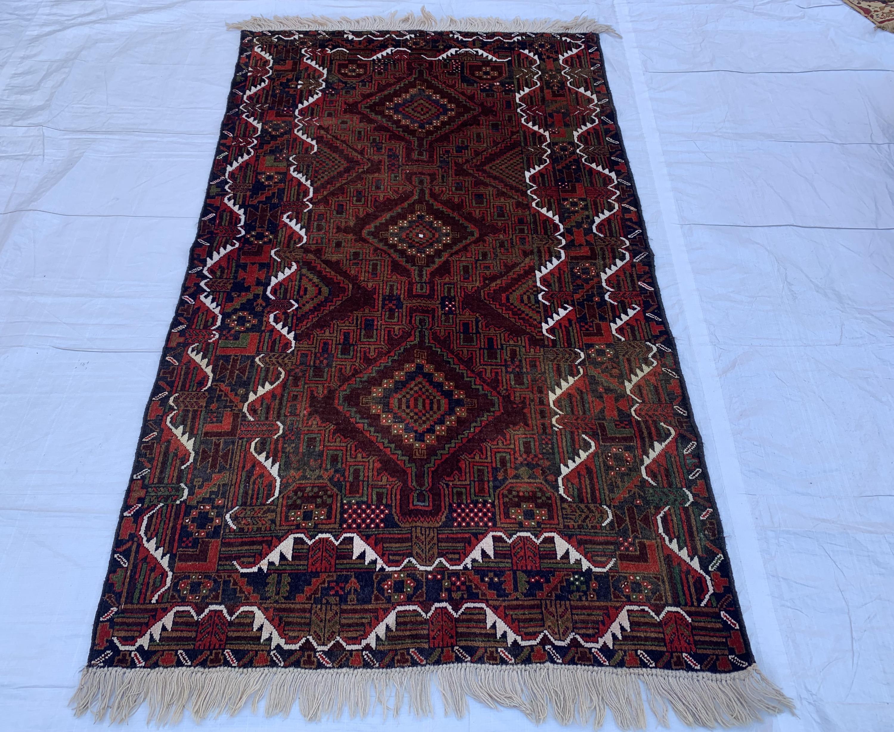 4x7 Vintage Baluchi Rug – Handmade Wool Tribal Carpet with Intricate Symbolic Patterns in Brown, Rust, and White, Living Room Rug 195x113
