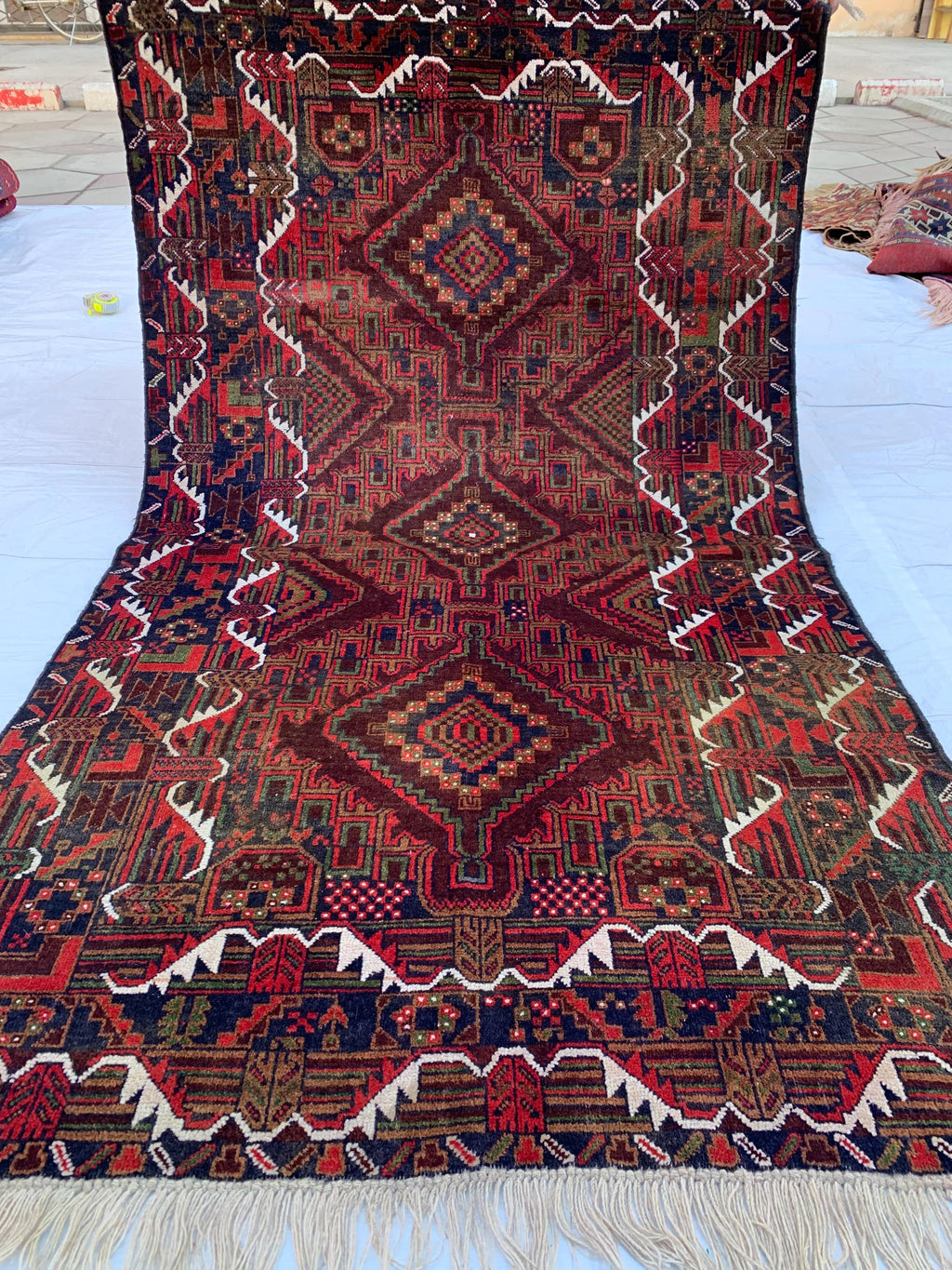 4x7 Vintage Baluchi Rug – Handmade Wool Tribal Carpet with Intricate Symbolic Patterns in Brown, Rust, and White, Living Room Rug 195x113