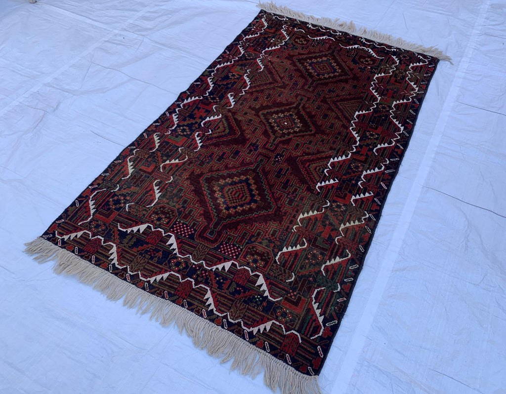 4x7 Vintage Baluchi Rug – Handmade Wool Tribal Carpet with Intricate Symbolic Patterns in Brown, Rust, and White, Living Room Rug 195x113
