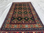 5x3 Geometric Maranus Rug – Hand-Knotted Afghan Tribal Carpet 5.4x3.4 ft | Vintage Wool Area Rug | Bold Green and Peach Bohemian Home Décor